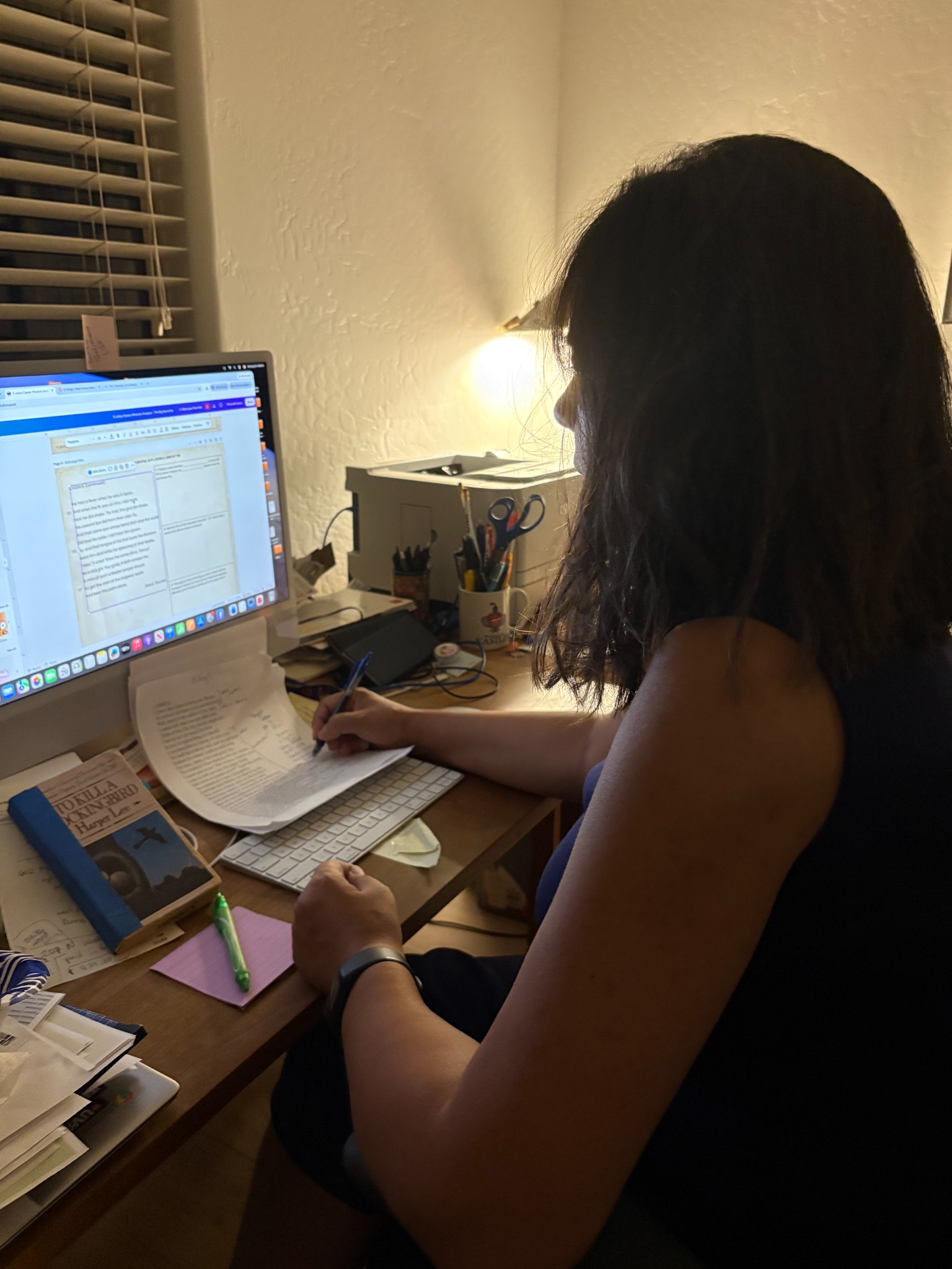 Leslie working at her desk on a Julius Caesar rhetoric project